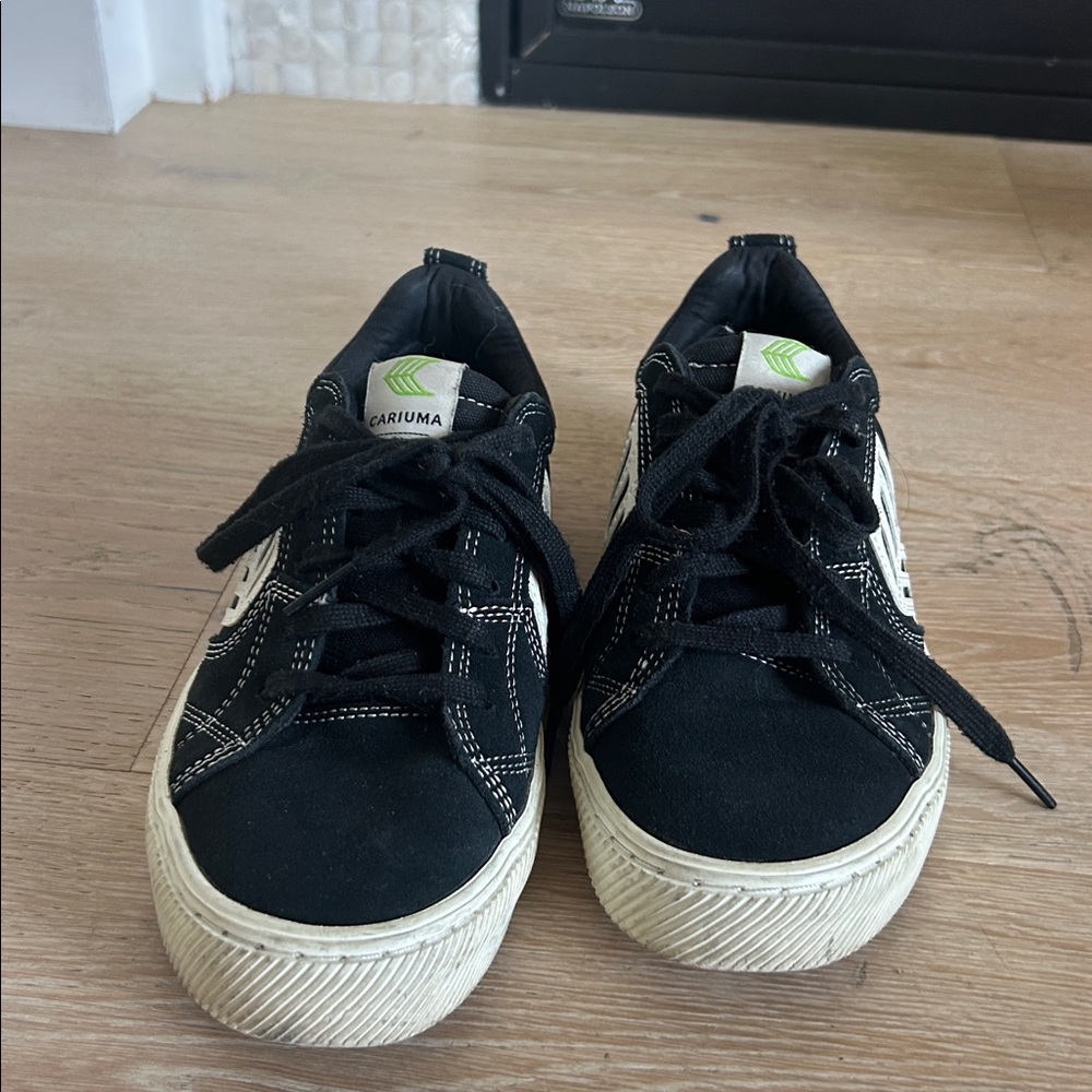 Cariuma Black and White Sneakers with Green Logo